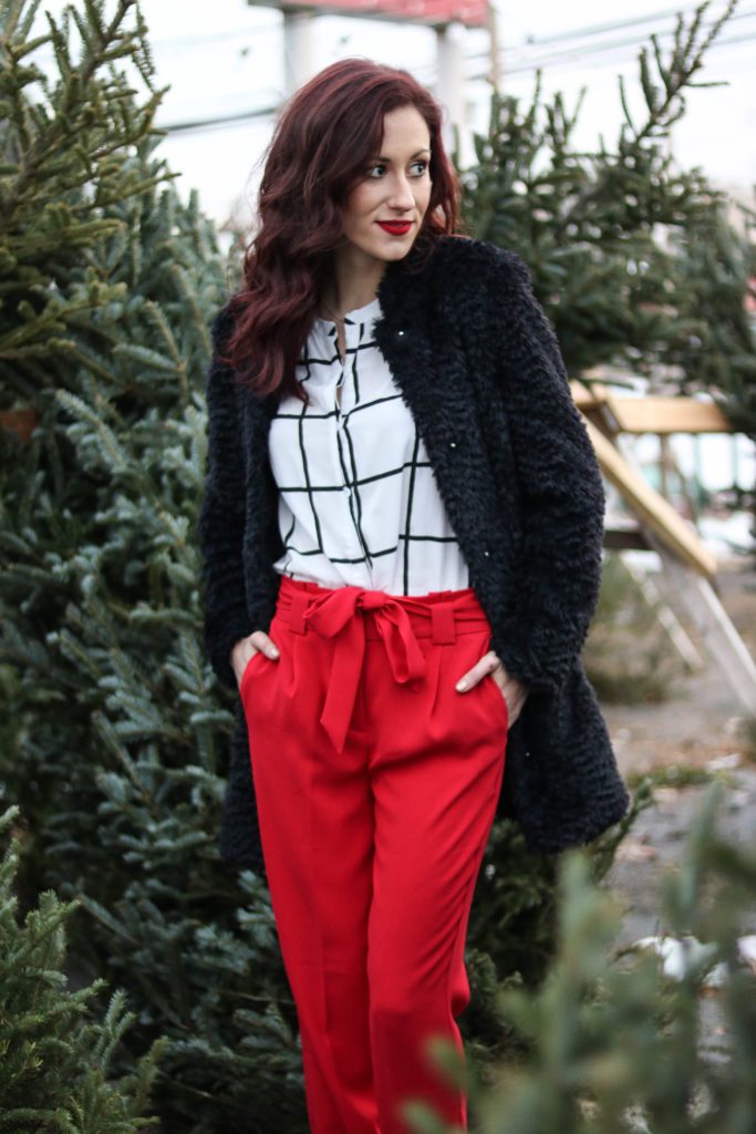 Premium Photo | Stylish woman in a beige coat and red pants