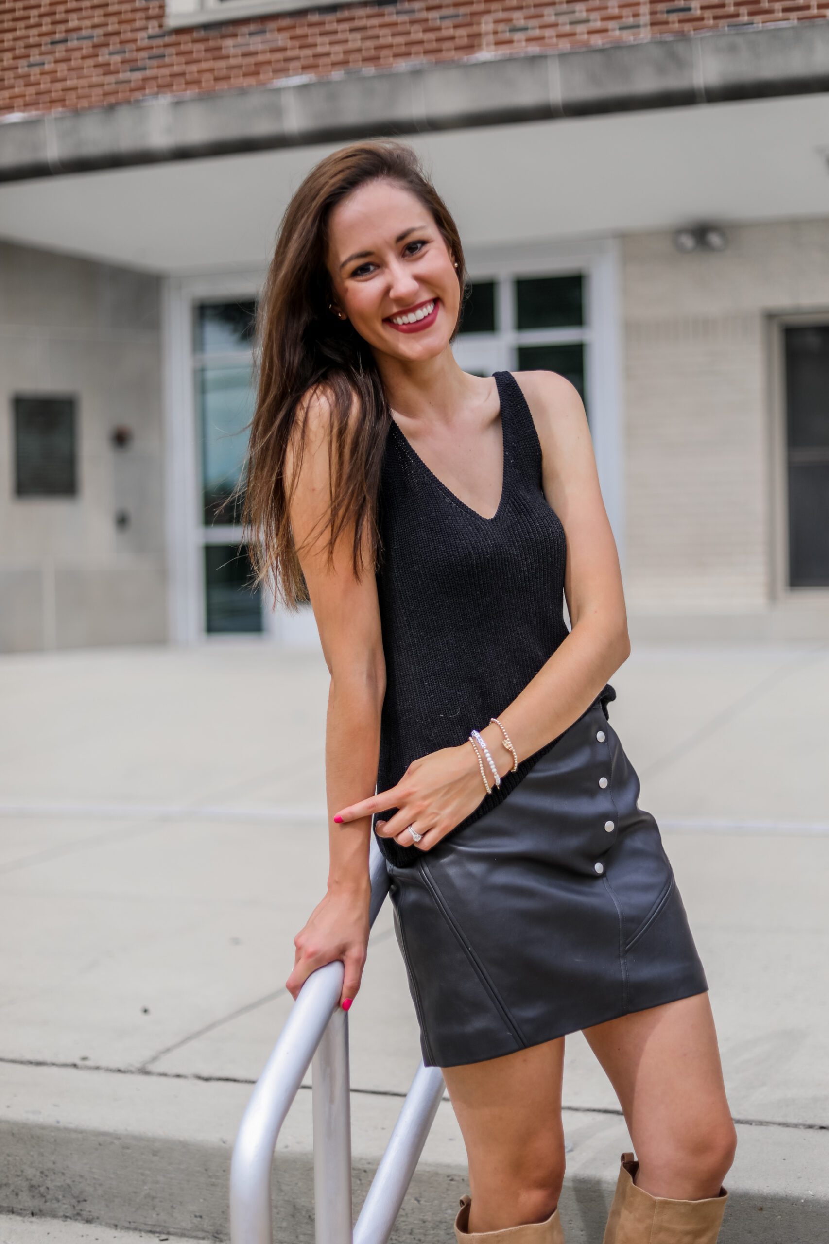 Faux leather skirt + sweater tank outfit on Coming Up Roses